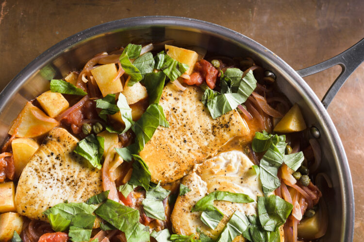Sicilian swordfish cooks gently in rustic tomato-caper sauce